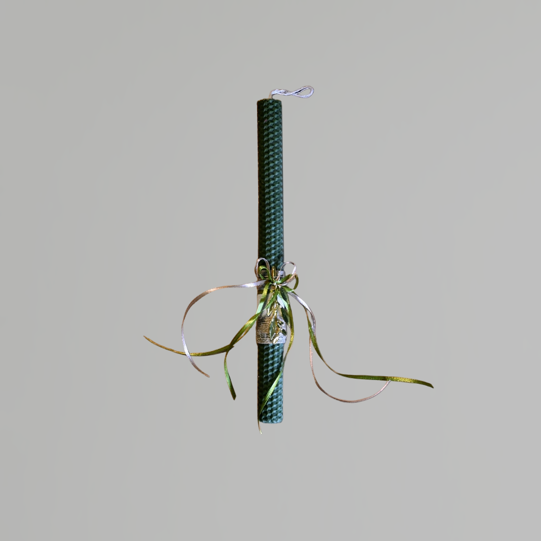 Easter colored candle with metal olive branch