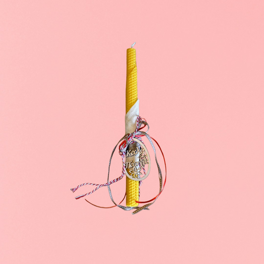 Easter candle with wooden decorative Easter egg