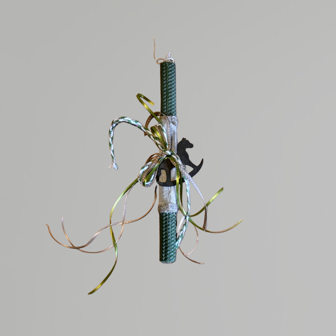 Easter colored candle with wooden decorative horse