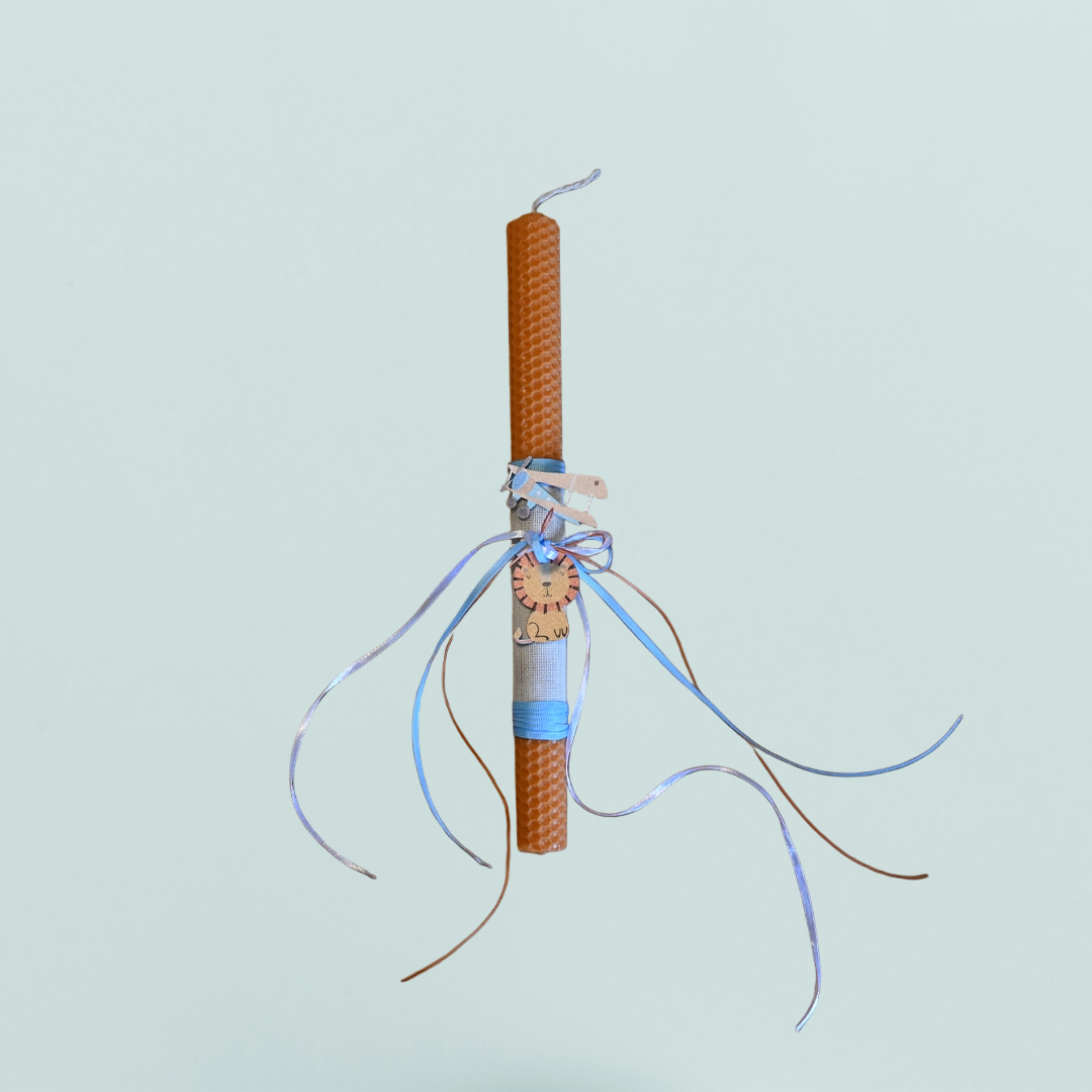 Easter colored candle with wooden lion