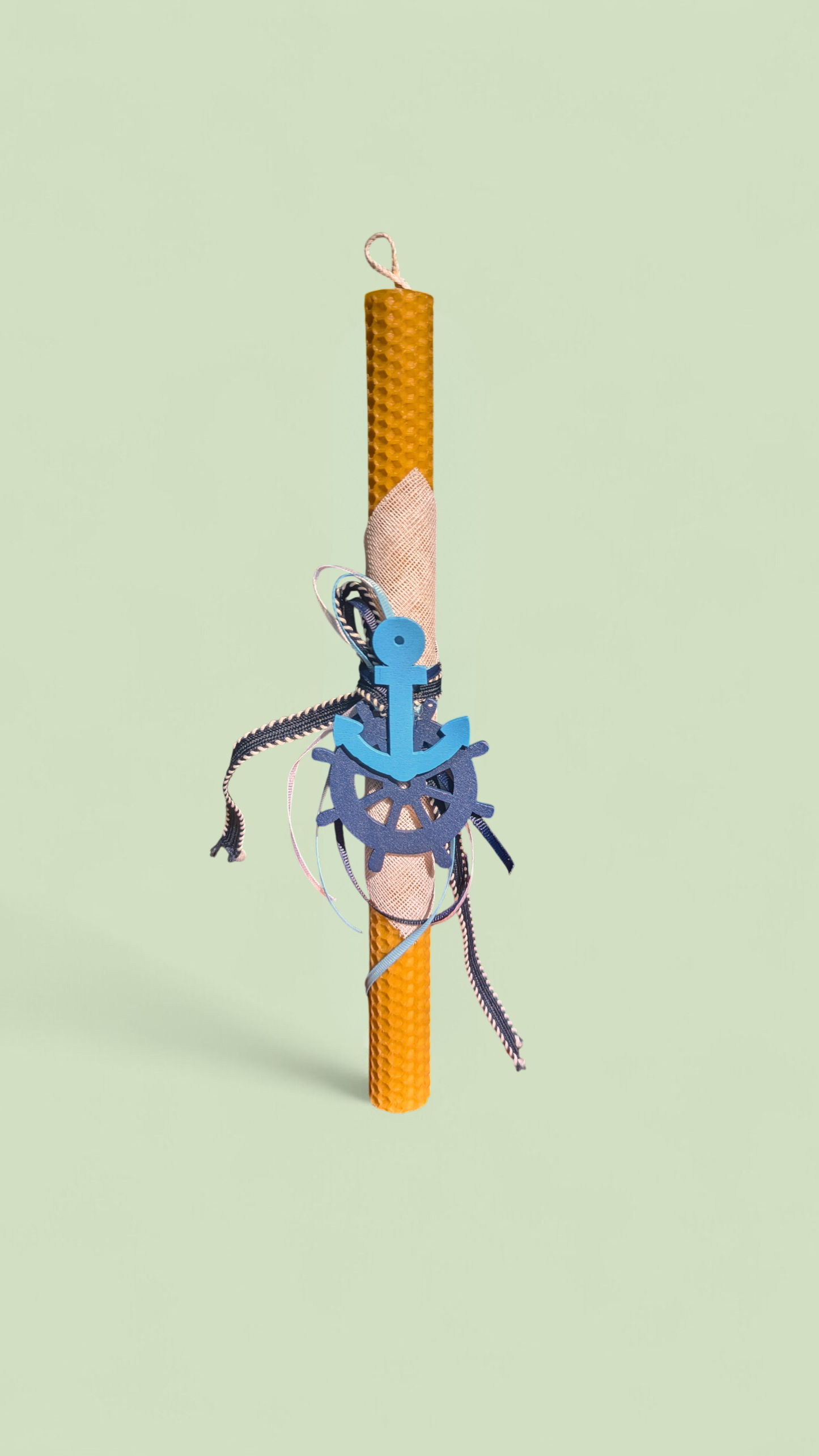 Easter candle with wooden nautical decorations