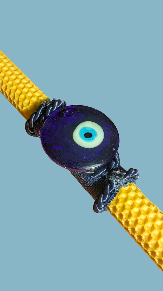 Easter candle with a lucky eye amulet