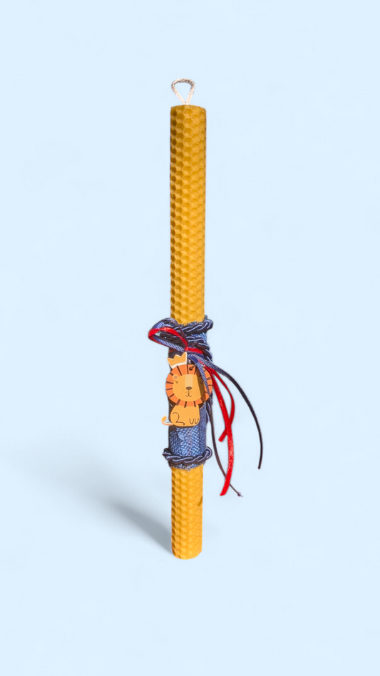 Easter colored candle with wooden lion